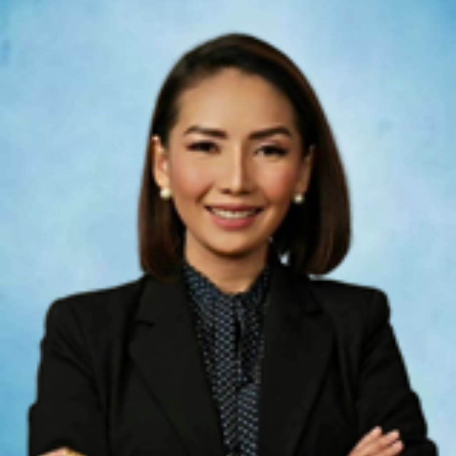 World Villages for Children Chona Day Chona Day smiling in a professional portrait against a light blue background.